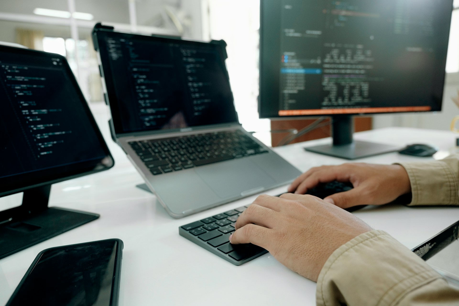 a man coding on a computer