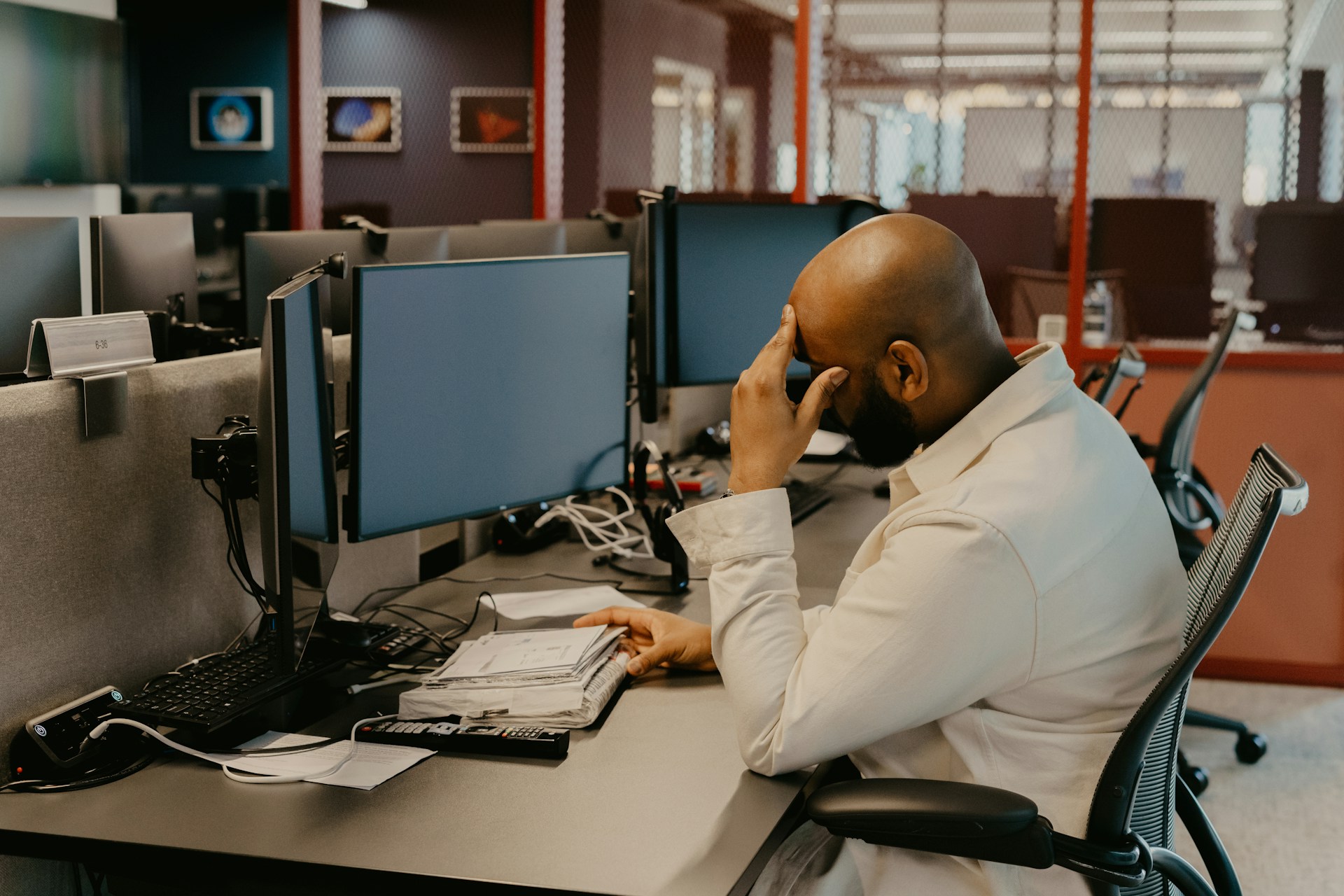 a man in distress sitting in front of his laptop